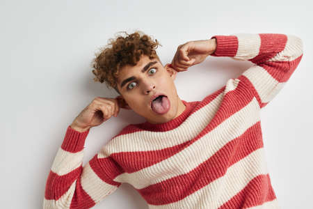 handsome young man hand gesture posing fun Lifestyle unalteredの写真素材