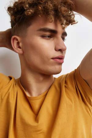 kinky guy in yellow t-shirts gesture hands emotions isolated background