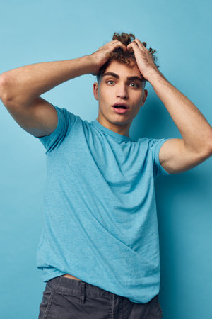 Attractive man emotions gesture hands posing isolated backgroundの写真素材