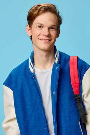 portrait of a cute teenager with a backpackの写真素材