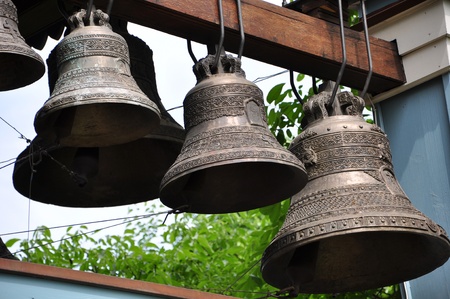 a number of bronze bells in the belfryの写真素材