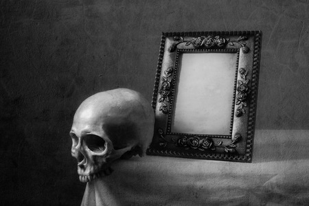 Still life black and white photography with frame and skullの写真素材