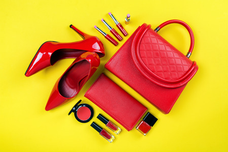 Overhead view of essential beauty items, Top view of red leather bag, red shoes and cosmeticの写真素材