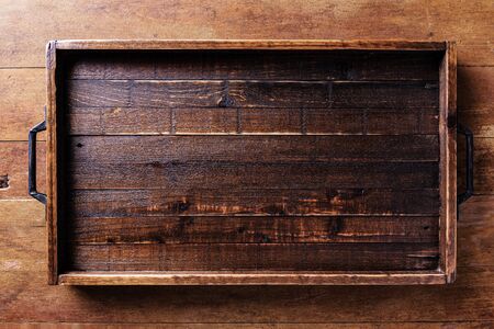 Empty wood tray on wood tableの写真素材