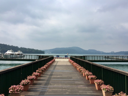 Boat pier junction at Sun Moon lake, Taiwan on a cloudy dayのeditorial素材