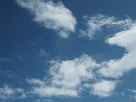 Blue sky with some cloudの写真素材