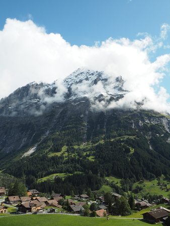 Mountain covering up with cloud with valley beneathの写真素材