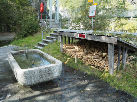 Stock of firewood beside the fountainの写真素材