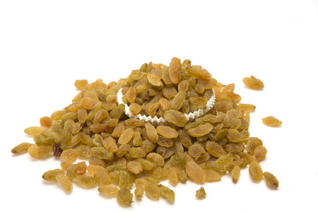 Dried raisins, kishmish in bowl isolated on white background.の写真素材