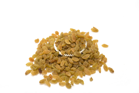 Dried raisin bowl over the white background.の写真素材
