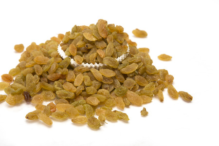 Sweet raisins heap isolated on white background.の写真素材