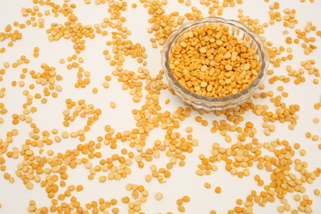 Yellow chana dal in glass bowl isolated on white backgroundの写真素材