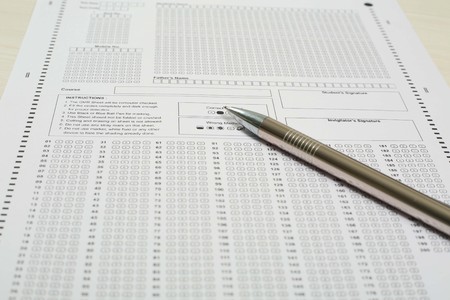 Picture of omr sheet and pen. Isolated on white background.