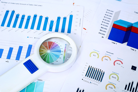 Picture of Magnifying glass on the graph paper.の写真素材