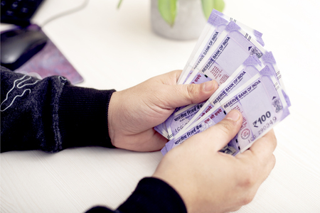 Picture of hand with new Indian currency.の写真素材