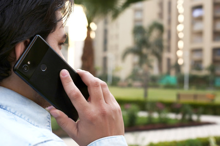 Young man is talking smartphone.の写真素材