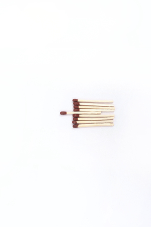 Photo of matches with brown head. Isolated on the white background.
