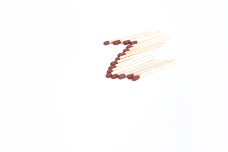 Collection of matchsticks with brown head.Isolated on the white background.の写真素材