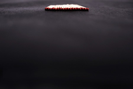 Picture of matchsticks in a row. Isolated on the black background.の写真素材