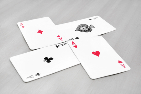 Picture of aces poker playing card. Isolated on the grey background.