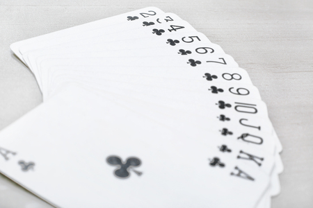 Picture of black playing cards poker casino. Isolated on the grey background.