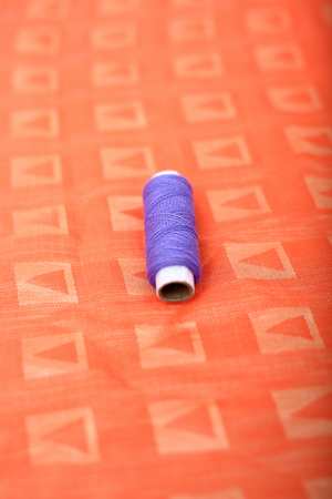 Picture of one thread on the orange cloth.