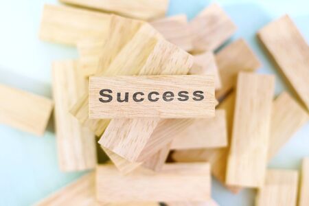 Success word written on wood block. Success text on wooden table for your design, concept.の写真素材