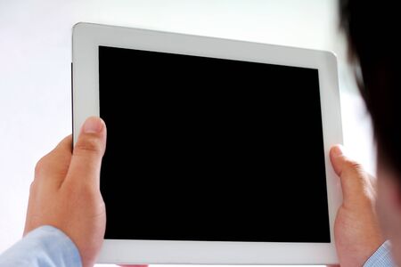 Man working on tablet. Isolated on white background.