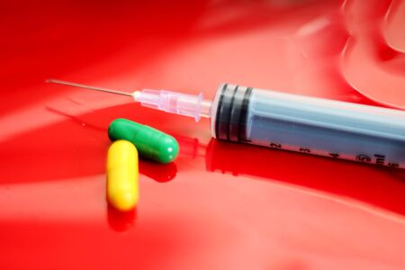 Picture of colorful capsule medicine and injection. Isolated on white background.の写真素材