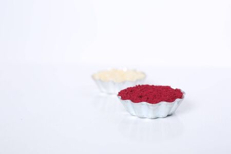 Indian festival: Raksha Bandhan background with an elegant Rakhi, Rice Grains and Kumkum. A...