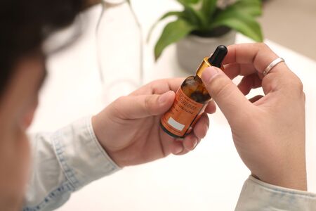 Picture of man drop medicine bottle holding in hand. Isolated on white background.