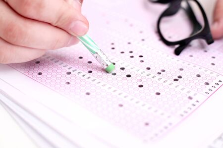 Picture of man filling OMR sheet.の写真素材