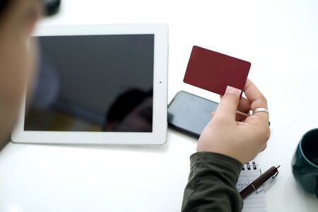 Picture of businessman working in office with tablet. Isolated on white background.の写真素材