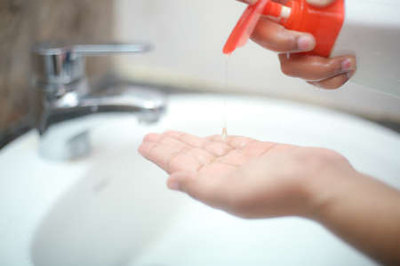 Wash hands with liquid soap gently to stay prevent from backterias and infectionsの写真素材