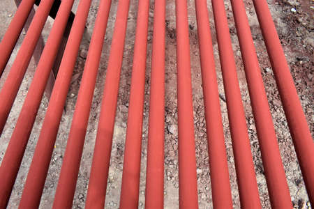 Red pipes for fire fighting system and extinguishing water lines in industrial building.