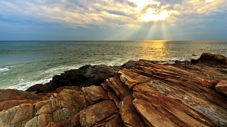 Rock beach in sunset time it