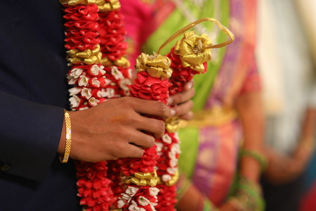 A Person Wearing Traditional Costume With Rose Petal Garlandsの写真素材