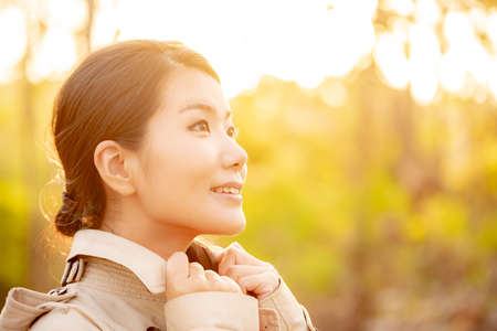 The image of a woman in the nature of autumnの写真素材