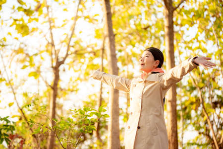 The image of a woman in the nature of autumnの写真素材