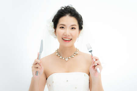 a bride with a knife and fork