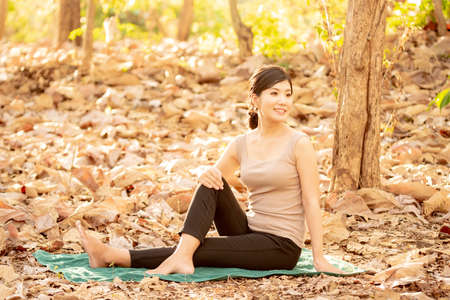 Japanese women doing yoga in nature