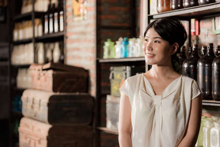 A Japanese woman in a room with a retro interiorの写真素材