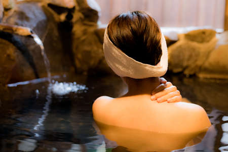 Woman taking a bath in Japanの写真素材