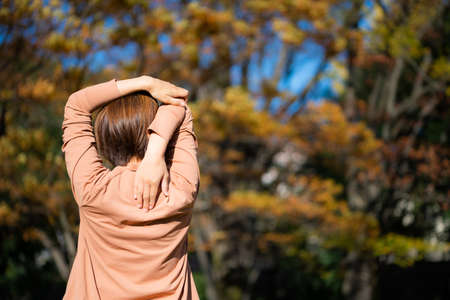Woman relaxing in autumn scenery