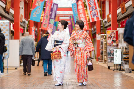 Unidentified Japanese woman in traditional kimono walking in Kyoto, Japanの写真素材
