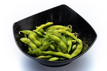 Green soybeans in bowl on white background, healthy food and nutritionの写真素材