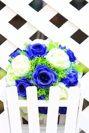 Floral white and navy blue  over white wood backgroundの写真素材