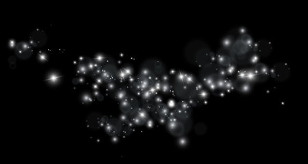 White sparks and golden stars shine with special light. Vector sparkles on a black background. Sparkling magical dust particles.のイラスト素材