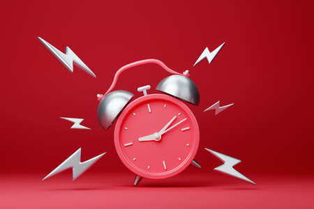 Red vintage ringing alarm clock with silver lightingsの写真素材