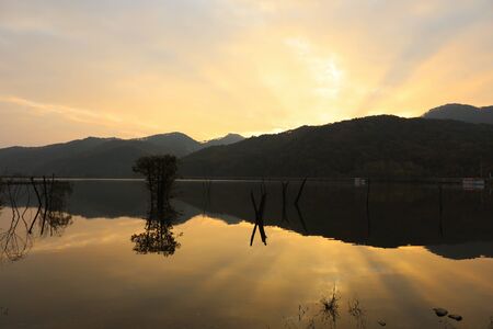 Reservoir morning beautiful sunrise reflection orange sky. Mungwang, Chungbuk, Koreaの写真素材